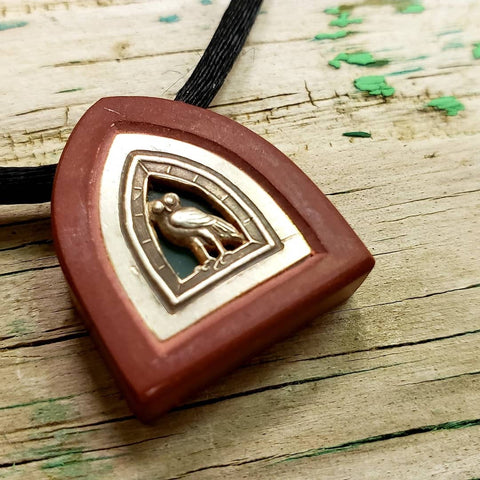 Hand carved pipestone and silver owl Pendant with translucent stone background